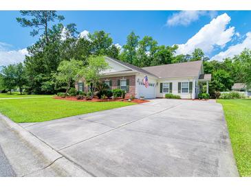 Charming single story home with brick and siding, well manicured lawn and long driveway at 111 Rose Water Loop # 111, Myrtle Beach, SC 29588