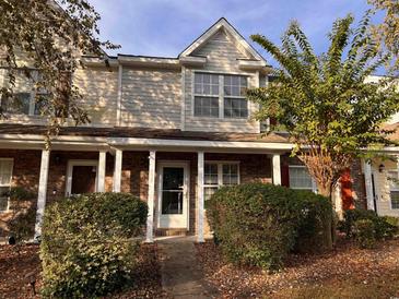 Charming brick townhome with covered front porch and lush landscaping at 238 Seabert Rd. # 238, Myrtle Beach, SC 29579