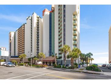 An attractive multi-story condo complex with well-manicured landscaping near a sandy beach at 2701 N Ocean Blvd. # 1260, Myrtle Beach, SC 29577