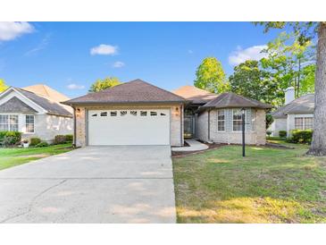Charming single story home with a two-car garage and well maintained lawn in a desirable community at 3107 Robyn Ct., Little River, SC 29566