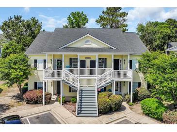 Charming two-story condo with double stairway access and well-maintained landscaping at 5038 Belleglen Ct. # 202, Myrtle Beach, SC 29579
