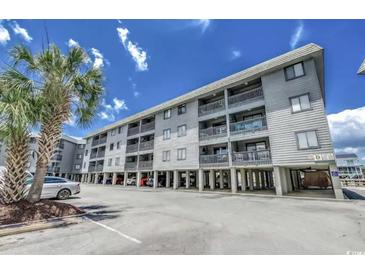 Coastal condo building with ample parking and elevated structure near the beach and ocean at 6001 N Ocean Blvd. # 342, North Myrtle Beach, SC 29582