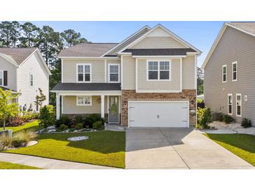 Charming two-story home with a two-car garage, well-maintained lawn, and inviting curb appeal at 1808 Zodiac Court, Myrtle Beach, SC 29577