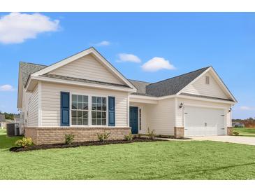 Charming single-Gathering home with white siding, brick accents, blue shutters and a well-maintained lawn at 192 Six Mile Creek Dr., Georgetown, SC 29440