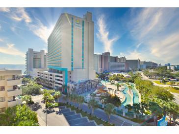 Grand Dunes Resort view showcasing its building and the outdoor pool area with a lazy river at 201 74Th Ave. N # 2638, Myrtle Beach, SC 29572