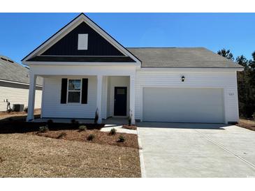 Charming single-Gathering home with a two-car garage and a welcoming front porch at 523 Blissful Ln., Little River, SC 29566