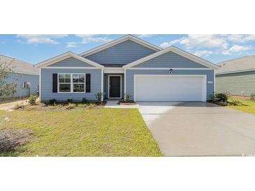 Charming single-story home featuring a two-car garage, well-manicured lawn and inviting curb appeal at 532 Scarlet Sage Dr., Conway, SC 29527