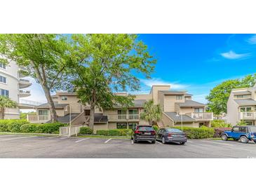 Charming condo building with lush landscaping, private balconies, and convenient parking at 9551 Edgerton Dr. # C-6, Myrtle Beach, SC 29572