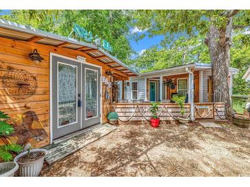Charming beach house exterior with nautical-themed decor and welcoming front porch at 6001-N73 South Kings Hwy., Myrtle Beach, SC 29575