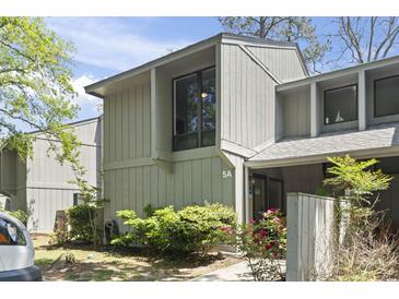 Inviting condo exterior with well-maintained landscaping and visible unit number at 306 Salt Marsh Circle # 5A, Pawleys Island, SC 29585
