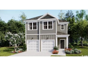 Charming two-story home features a modern gray exterior, double garage, and beautifully landscaped front yard at 437 Falling Leaf Loop, Myrtle Beach, SC 29588