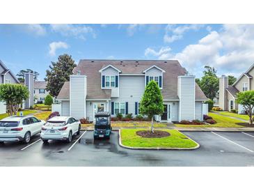 Charming townhouse featuring a manicured lawn, two-story structure, and convenient parking at 503 20Th Ave. N # 46 B, North Myrtle Beach, SC 29582