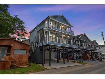 Three-story beach home with spacious balconies and ample parking underneath at 6001 - 1793 S Kings Hwy., Myrtle Beach, SC 29575