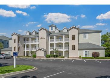 Attractive condo building featuring multiple balconies and lush landscaping, perfect for a relaxed lifestyle at 1001 World Tour Blvd. # 203, Myrtle Beach, SC 29579