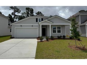 Charming single-Gathering home featuring a two-car garage and well-maintained front lawn at 1019 Laconic Dr., Myrtle Beach, SC 29588