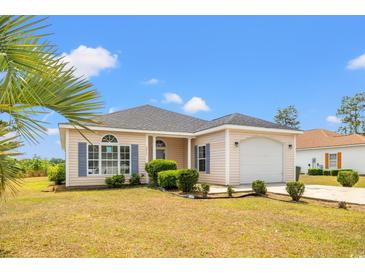 Charming single-story home with manicured lawn, attached garage, and welcoming curb appeal at 2951 Mary Hines Ln., Georgetown, SC 29440