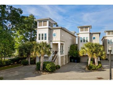 Charming coastal home with private entrance and manicured landscaping and beautiful architectural design at 600 48Th Ave. S # 201, North Myrtle Beach, SC 29582