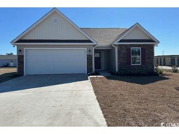 Charming single-story home with a two-car garage and well-maintained landscaping at 926 Padgett Lane, Conway, SC 29526