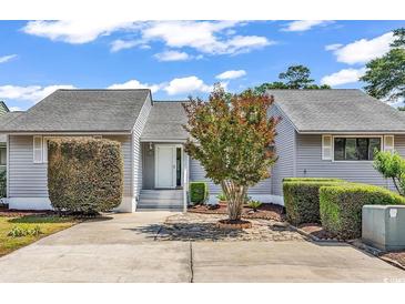 Charming home featuring a well-maintained yard and inviting entryway at 4339 Baldwin Ave. # 4339, Little River, SC 29566