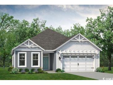 Charming single-story home featuring a two-car garage and a beautifully landscaped front yard with mature trees at 1192 Halter Pl., Calabash, NC 28467