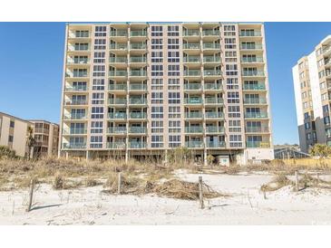 Large condo building with balconies overlooks the beach and ocean at 2507 S Ocean Blvd., North Myrtle Beach, SC 29582