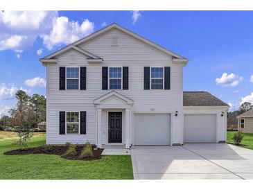 Charming two-story home with white siding, black shutters, and a spacious two car attached garage at 36 Cape Point Dr., Conway, SC 29527