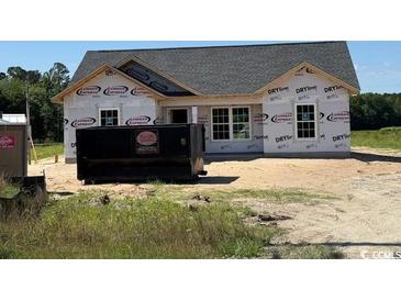 New construction home featuring a gray roof, white trim, and a spacious lot, ready for personalization at 6704 Joyner Swamp Rd., Galivants Ferry, SC 29544