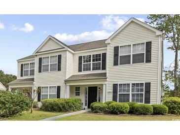 Inviting two-story home featuring black shutters, manicured lawn, and charming curb appeal at 1065 Harvester Circle, Myrtle Beach, SC 29579
