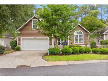 Charming single-Gathering home featuring a two-car garage and a well-maintained lawn at 4803 Bucks Bluff Dr., North Myrtle Beach, SC 29582