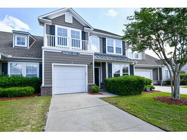 Charming two-story home features a one-car garage, balcony and well-maintained landscaping and a manicured lawn at 6172 Catalina Dr. # 515, North Myrtle Beach, SC 29582
