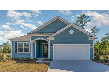 Charming one-story home with blue siding, a two-car garage, and well-manicured lawn at 764 Choctaw Dr., Conway, SC 29526