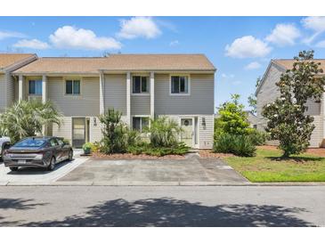 Charming townhome with well-maintained landscaping and a private driveway at 951 Plantation Dr. # F8, Little River, SC 29566