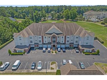 A scenic aerial view of the condo complex, showcasing manicured lawns and ample parking at 2241 Waterview Dr. # 537, North Myrtle Beach, SC 29582