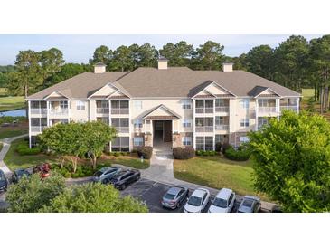 Attractive multi-Gathering home boasts well-maintained landscaping, private balconies, and convenient parking at 260 Woodlands Way # 2, Calabash, NC 28467