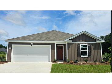 Charming single-story home with a two-car garage and well-manicured lawn at 406 Acosta Circle, Conway, SC 29527