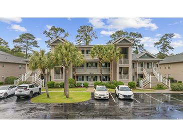 Coastal condominium exterior showcasing multiple levels with parking, landscaping, and stairway access at 69 Pinehurst Ln. # 3-F, Pawleys Island, SC 29585