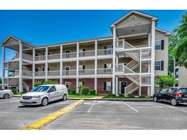 Spacious multi-story condo complex with charming balconies and ample parking on a beautiful day at 1058 Sea Mountain Hwy. # 4-203, North Myrtle Beach, SC 29582