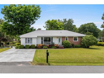 Charming single story home with a well maintained lawn and mature landscaping at 1127 Pine Dr., Myrtle Beach, SC 29577