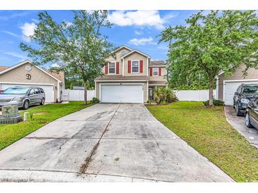 Inviting two-story home with a spacious driveway, attached garage, and well-maintained front yard at 2546 Whetstone Ln., Myrtle Beach, SC 29579