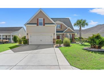 Charming home featuring a well-manicured lawn and a spacious driveway, offering curb appeal at 5146 Fairmont Ln., Myrtle Beach, SC 29579