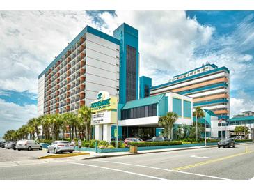 Attractive Landmark Resort building with palm trees and well-maintained landscaping at 1501 S Ocean Blvd. # 1232, Myrtle Beach, SC 29577