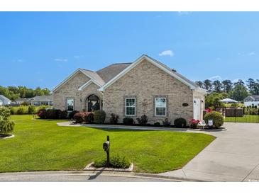 Charming one-story brick home with well-maintained lawn and landscaping at 413 Wine Ct., Conway, SC 29527