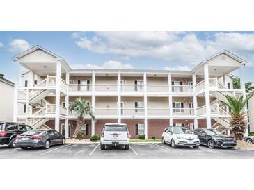 Three story condo building featuring brick facade, off-street parking and convenient exterior staircases at 1058 Sea Mountain Hwy. # 3-201, North Myrtle Beach, SC 29582