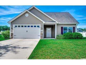 Charming single-Gathering home features a two-car garage, well-manicured lawn, and inviting entryway at 176 Springtide Dr., Conway, SC 29527