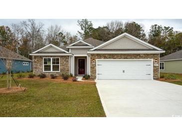 Charming single-story home featuring stone accents and a well-maintained front yard at 444 Clear Lake Dr., Conway, SC 29526