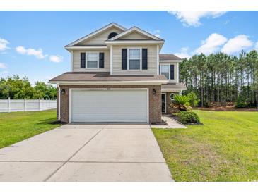Charming two-story home featuring a spacious two-car garage and a well-maintained lawn in a Gathering-friendly neighborhood at 4603 East Walkerton Rd., Myrtle Beach, SC 29579