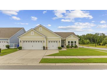 Charming single-story home featuring a well-manicured lawn and a two-car garage at 2300 Lark Sparrow St., Myrtle Beach, SC 29577