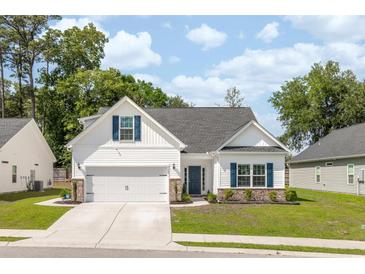 Charming single-Gathering home with a well-manicured lawn, two-car garage, and inviting curb appeal at 2609 Seaport Circle, Georgetown, SC 29440