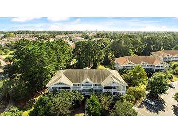Beautiful aerial view of the condo complex surrounded by lush greenery in a desirable community at 5825 Catalina Dr. # 124, North Myrtle Beach, SC 29582