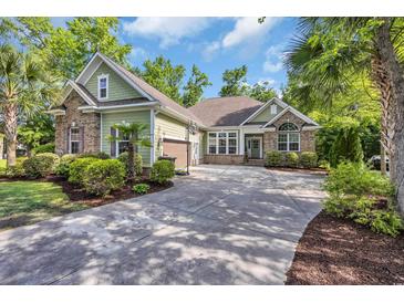 Charming home with a well-manicured lawn, brick accents, and inviting driveway at 840 Jeter Ln., Myrtle Beach, SC 29588